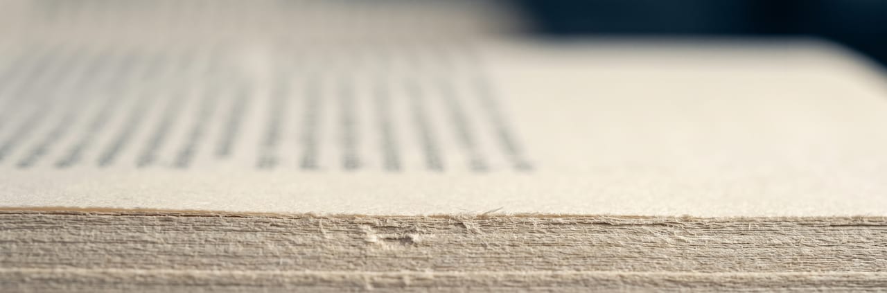 Close view across a printed journal page, one line in focus.